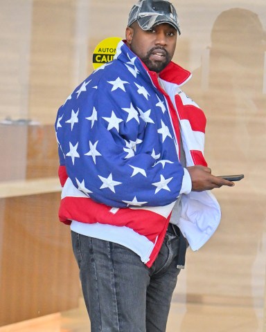 Kanye West heads to a meeting in Sherman Oaks after church. Kanye was seen wearing an oversized American flag bomber jacket. 27 Nov 2022 Pictured: Kanye West. Photo credit: @CelebCandidly/ Snorlax / MEGA TheMegaAgency.com +1 888 505 6342 (Mega Agency TagID: MEGA921309_001.jpg) [Photo via Mega Agency]