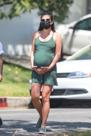 Santa Monica, CA - *EXCLUSIVE* pregnant Lea Michele wears a protective mask holding her growing belly as she sets out for a walk in Santa Monica with her mother, Edith Sarfati, as Governor Gavin Newsom heads to California Orders a new series.  Lee, seen in a green outfit and sneakers, drowned in Piru Lake, a day after authorities recovered the body of Glee co-star Naya Rivera.  Image: Lea MicheleBackgrid USA 14 July 2020 USA: +1 310 798 9111 / usasales @ backgrid.comUK: +44 208 344 2007 / uksales@backgrid.com *UK Clients - Images with children please pixelate before publication*