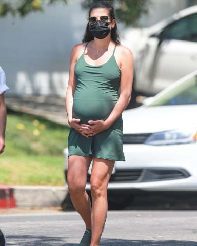 Santa Monica, CA - *EXCLUSIVE* Pregnant Lea Michele wears a protective mask while holding her growing belly as she steps out for a walk in Santa Monica with her mother Edith Sarfati, as Gov. Gavin Newsom orders a new series of closures for California. Lea was seen in a green dress and sneakers out for a stroll a day after authorities recovered the body of Glee co-star Naya Rivera who drowned in Lake Piru.Pictured: Lea MicheleBACKGRID USA 14 JULY 2020 USA: +1 310 798 9111 / usasales@backgrid.comUK: +44 208 344 2007 / uksales@backgrid.com*UK Clients - Pictures Containing ChildrenPlease Pixelate Face Prior To Publication*