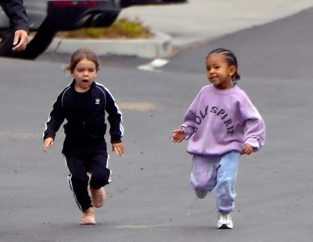 Kim Kardashian and Saint West head out of Kanye's Sunday Services. Saint was seen wearing his father's very expensive clothes from the Sunday services line. Saint was also seen running with his little cousin Reign through the parking lot. 26 May 2019 Pictured: Kim Kardashian, Saint West, Kourtney Kardashian, Reign Disick. Photo credit: Marksman/ Snorlax / MEGA TheMegaAgency.com +1 888 505 6342 (Mega Agency TagID: MEGA430339_014.jpg) [Photo via Mega Agency]