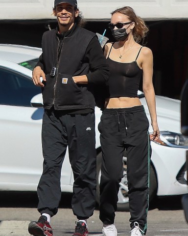 Los Angeles, CA  - *EXCLUSIVE*  - Young actress and model Lily-Rose Depp snapped with French rapper Yassine Stein as they arrive at Astro Burger for lunch.  Depp reportedly started dating Stein last September.  He’s the latest in a string of the starlet’s romances. Just three months earlier she was caught partaking in a heavy makeout session with actor Austin Butler while in London.  Prior to that, the young Depp was in a relationship with her “The King” co-star, Timothée Chalamet. The two made headlines several times for an endless array of PDA throughout their romance.  Pictured: Lily-Rose Depp, Yassine Stein  BACKGRID USA 6 FEBRUARY 2022   USA: +1 310 798 9111 / usasales@backgrid.com  UK: +44 208 344 2007 / uksales@backgrid.com  *UK Clients - Pictures Containing Children Please Pixelate Face Prior To Publication*