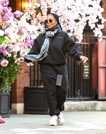 London, UNITED KINGDOM - * EXCLUSIVE * - Smiling Janet Jackson seen for the FIRST TIME since the revealing documentary about her life aired as she twirls round in the street on Wednesday.  Janet is spotted leaving a florist in central London after not being seen for over a YEAR in the capital where she lives.  The singer who has just done a Netflix documentary about her career and life looked dressed down in an Alexander Wang tracksuit with her hair in braids with one blue braid.  Janet looked happier than ever after moving on from her divorce from Wissam Al Mana.  Janet has invested in a mobile phone holder since being caught driving with her mobile in her hand last year.  Janet was also spotted bumping into her makeup artist Coura Ly.Pictured: Janet JacksonBACKGRID USA 10 MARCH 2022 USA: +1 310 798 9111 / usasales@backgrid.comUK: +44 208 344 2007 / uksales@backgrid.com*UK Clients - Pictures Containing ChildrenPlease Pixelate Face Prior To Publication *