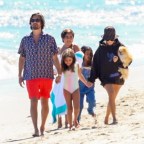 Kourtney Kardashian and Scott Disick go for a walk on the beach with their brood and friend Luka Sabbat