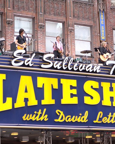 Paul McCartney 'The Late Show with David Letterman', New York, America - 15 Jul 2009 It was almost like January 1969 all over again, as Paul McCartney took to the top of the marquee of the Ed Sullivan Theatre for his performance last night on ‘The Late Show with David Letterman’ – a performance reminiscent of the Beatles’ iconic rooftop performance 40 years on top of the Apple Studios on London’s Savile Row.  It also harked back to another moment 45 years ago when the Beatles made their first American appearance at that same Ed Sullivan Theater.  Aptly, McCartney played the same song that his old band performed three times on top of the Apple Studios, ‘Get Back’, fittingly followed by one of his new songs, ‘Sing The Changes’, from his latest album, ‘Electric Arguments’, much to the delight of the assembled fans on the street down below, before chatting to host Letterman about that first US appearance and his relationship with the late Michael Jackson.