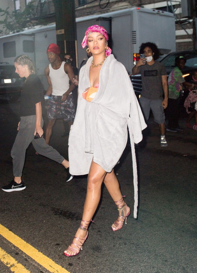 Rihanna wears a robe on-set
