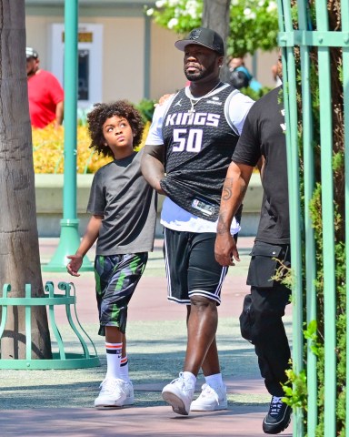 EXCLUSIVE: 50 cent wears his name on a jersey as he takes a trip to Disneyland with his son. 03 Aug 2022 Pictured: 50 cent. Photo credit: Snorlax / MEGA TheMegaAgency.com +1 888 505 6342 (Mega Agency TagID: MEGA883715_001.jpg) [Photo via Mega Agency]