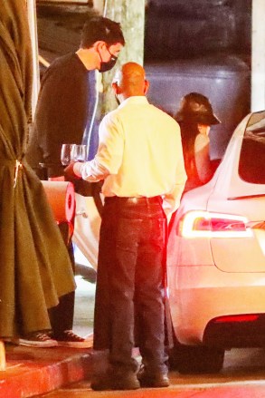 Los Angeles, CA  - *EXCLUSIVE* Singer Ariana Grande keeps a low profile while on a dinner date with fiance Dalton Gomez. The couple who got engaged last December were spotted exiting the restaurant after a date night. Ariana and Daton, a real estate agent certainly have lots to discuss. According to various reports, the couple are planning a small, intimate wedding early this summer.Pictured: Ariana Grande, Dalton GomezBACKGRID USA 15 APRIL 2021 USA: +1 310 798 9111 / usasales@backgrid.comUK: +44 208 344 2007 / uksales@backgrid.com*UK Clients - Pictures Containing ChildrenPlease Pixelate Face Prior To Publication*