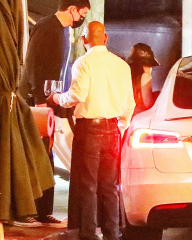 Los Angeles, CA  - *EXCLUSIVE* Singer Ariana Grande keeps a low profile while on a dinner date with fiance Dalton Gomez. The couple who got engaged last December were spotted exiting the restaurant after a date night. Ariana and Daton, a real estate agent certainly have lots to discuss. According to various reports, the couple are planning a small, intimate wedding early this summer.  Pictured: Ariana Grande, Dalton Gomez  BACKGRID USA 15 APRIL 2021   USA: +1 310 798 9111 / usasales@backgrid.com  UK: +44 208 344 2007 / uksales@backgrid.com  *UK Clients - Pictures Containing Children Please Pixelate Face Prior To Publication*