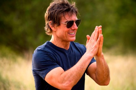 Impressed Tom Cruise applauded a group of enthusiastic young fans who serenaded him with the theme from Top Gun in South Africa.  The Hollywood superstar put his hand on his heart, smiled and waved as he was greeted by singing locals in the bush town of Hoedspruit, Limpopo, on March 5. Cruise is filming the next Mission: Impossible in South Africa.  BYLINE: Jannie Nikola Photography / Mega.  05 Mar 2022 Pictured: Tom Cruise reacts to being serenaded with the Top Gun theme song from fans in Hoedspruit, South Africa.  * BYLINE: Jannie Nikola Photography / Mega.  Photo credit: Jannie Nikola Photography / Mega TheMegaAgency.com +1 888 505 6342 (Mega Agency TagID: MEGA834759_003.jpg) [Photo via Mega Agency]