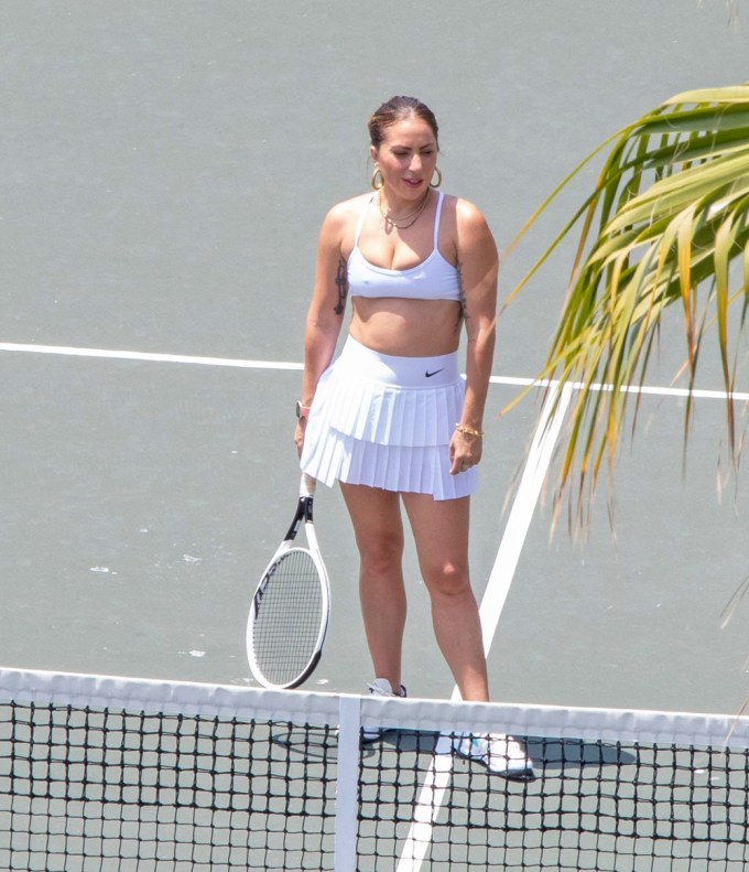 Lady Gaga plays tennis on a trip with her boyfriend