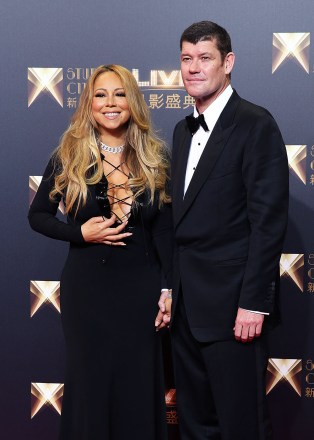 Melco Crown Entertainment's Co-chairman, James Packer, right, and singer Mariah Carey pose on the red carpet of the opening ceremony for the Studio City project in Macau, Tuesday, Oct. 27, 2015. (AP Photo/Kin Cheung)