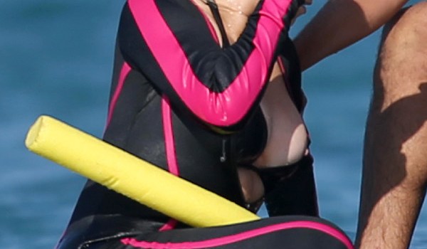 Mariah Carey Has Nip Slip on The Beach While With Her New Backup