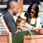 Kim Kardashian and Kanye West take yuoung daughter North on the Cars Ride as they are spotted celebrating her 2nd birthday at Disneyland in Anaheim, Ca