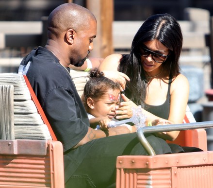 Kim Kardashian and Kanye West take yuoung daughter North on the Cars Ride as they are spotted celebrating her 2nd birthday at Disneyland in Anaheim, Ca

Pictured: Kanye West,North West and Kim Kardashian,Kanye West
North West
Kim Kardashian
Kourtney Kardashian
Penelope Disick
Ref: SPL1053608 150615 NON-EXCLUSIVE
Picture by: SplashNews.com

Splash News and Pictures
Los Angeles: 310-821-2666
New York: 212-619-2666
London: +44 (0)20 7644 7656
Berlin: +49 175 3764 166
photodesk@splashnews.com

World Rights