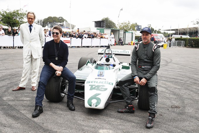 Tom Cruise Poses With A Racecar