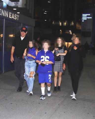 EXCLUSIVE: Matt Damon and family as they arrive to Harry Styles concert in New York City. Matt was all smiles as he treated his young guests to a night out to see the British rocker inside the World's Most Famous Arena. Some other guests were spotted walking with signs in the street and dressed in Harry attire. 04 Oct 2021 Pictured: Matt Damon and family. Photo credit: MEGA TheMegaAgency.com +1 888 505 6342 (Mega Agency TagID: MEGA793353_005.jpg) [Photo via Mega Agency]