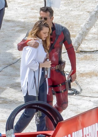 London, UNITED KINGDOM  - *EXCLUSIVE*  - Blake Lively visits the Deadpool 3 set with her sisters Lori and Robyn and their partners as Ryan Reynolds dressed as Deadpool plants a kiss on her head. Ryan's daughter was seen with a cute Wolverine toy as she spoke to her dad! Awkward!They have been filming in London for the new Deadpool film.Pictured: Ryan Reynolds, Blake Lively, Lori Lively, Robyn LivelyBACKGRID USA 12 JULY 2023 BYLINE MUST READ: Click News and Media / BACKGRIDUSA: +1 310 798 9111 / usasales@backgrid.comUK: +44 208 344 2007 / uksales@backgrid.com*UK Clients - Pictures Containing ChildrenPlease Pixelate Face Prior To Publication*