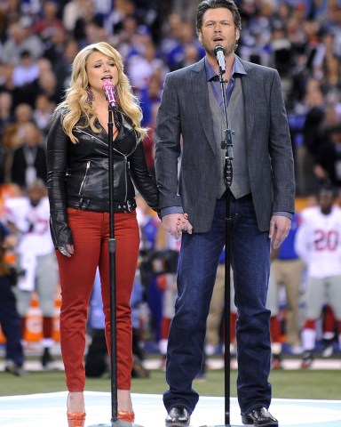 Husband and Wife Country Singers Miranda Lambert (l) and Blake Shelton (r) Sing During the Pregame Show in Lucas Oil Stadium Prior to Super Bowl Xlvi Between the New England Patriots and the New York Giants in Indianapolis Indiana Usa 05 February 2012 the Super Bowl is Annual Championship of the National Football League United States Indianapolis
Usa American Football Super Bowl Xlvi - Feb 2012