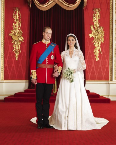 Editorial use only Mandatory Credit: Photo by Hugo Burnand/Clarence House/REX/Shutterstock (1310831b) Prince William Prince William with his bride Catherine the Catherine Duchess of Cambridge Official Portraits of the wedding of Prince William and Catherine Middleton, London, Britain - 29 Apr 2011 Official Royal Wedding pictures released by Clarence House show the bride and groom in the throne room at Buckingham Palace with Bridesmaids and Page boys along with other members of the Royal Family