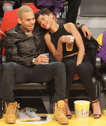 Chris Brown and Rihanna laugh and snuggle as they make  their 1st public appearance together since their very public break up as they attend the Los Angeles Lakers Vs The New York Knicks Basketball Game at the Staoles Center in Los Angeles, CaPictured: Chris Brown and Rihanna,Chris BrownRihannaRef: SPL474572 261212 NON-EXCLUSIVEPicture by: SplashNews.comSplash News and PicturesLos Angeles: 310-821-2666New York: 212-619-2666London: +44 (0)20 7644 7656Berlin: +49 175 3764 166photodesk@splashnews.comWorld Rights