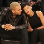 Chris Brown and Rihanna laugh and snuggle as they make  their first public appearance together since their very public break up as they attend the Los Angeles Lakers Vs The New York Knicks Basketball Game