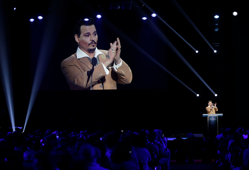 Actor Johnny Depp, thanks fans as he makes a surprise appearance at Disney's D23 Expo, a fan convention, to accept the Disney Legend honor, in Anaheim, Calif. Depp has starred in Disney's "Pirates of the Caribbean" series as Captain Jack Sparrow as well as their live-action "Alice in Wonderland" as the Mad Hatter. D23, now in its fourth year, runs through Sunday
Disney Expo Johnny Depp, Anaheim, USA