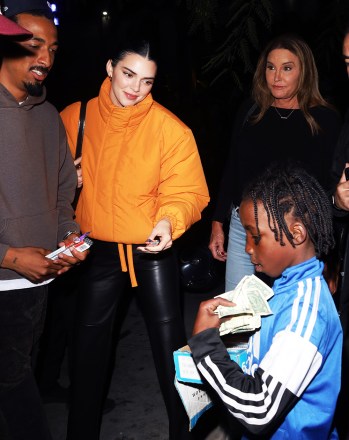 Kendall Jenner and friends buy candy from a young street vendor as she and her father Caitlyn Jenner participate in the Clippers Game at Crypto.com Arena in Los Angeles, CA.  Photo: Kendall Jenner, Caitlyn Jenner Ref: SPL5496636 231022 NON-exclusive Photo by: Damian Avitia / London Entertainment / SplashNews.com Splash News and Pictures USA: +1 310-525-5808 London: +44 (0) 20 8126 1009 Berlin : +49 175 3764 166 photodesk@splashnews.com World rights
