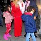 Mariah Carey celebrates her Christmas song potentially going #1 with her boyfriend and kids