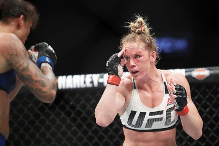 Holly Holm, Germaine de Randamie Holly Holm, right, fights Germaine de Randamie, of the Netherlands, during a women's featherweight championship mixed martial arts bout at UFC 208, in New York. de Randamie won the fightUFC 208 Mixed Martial Arts Holm de Randamie, New York, USA - 12 Feb 2017