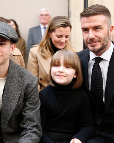 Romeo Beckham, Harper Beckham and David Beckham in the front row Victoria Beckham show, Front Row, Fall Winter 2019, London Fashion Week, UK - 17 Feb 2019