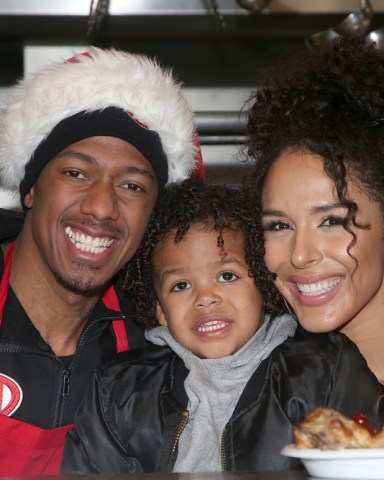 Christmas Celebration On Skid Row held at Los Angeles Mission. Photo Credit: FS/AdMediaPictured: Nick Cannon,Golden Cannon,Brittany BellRef: SPL5137200 231219 NON-EXCLUSIVEPicture by: FS/AdMedia / SplashNews.comSplash News and PicturesUSA: +1 310-525-5808London: +44 (0)20 8126 1009Berlin: +49 175 3764 166photodesk@splashnews.comWorld Rights