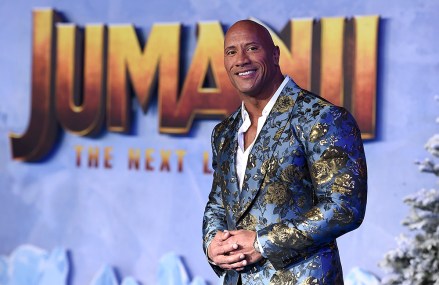 Cast member Dwayne Johnson poses for photographers at the Los Angeles premiere of "Jumanji: The Next Level," at the TCL Chinese Theater, Monday, Dec.  9, 2019. (Photo by Jordan Strauss / Invision / AP)