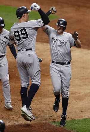 New York Yankees batter DJ LeMahieu (R) celebrates with teammate Aaron Judge (L) after hitting a game-tying  two-run home run in the top of the ninth inning of their MLB American League Championship Series playoff baseball game six at Minute Maid Park in Houston, Texas, USA, 19 October 2019. The winner of the best-of-seven series will go on to face the Washington Nationals in the World Series.
New York Yankees at Houston Astros, USA - 19 Oct 2019