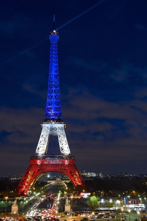 The Eiffel Tower lit up in the red, white and blue of the French flag
Tributes to the victims of the Paris terrorist attacks, Paris, France - 18 Nov 2015