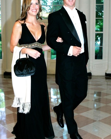 Peyton Manning, Ashley Manning Indianapolis Colts quarterback Peyton Manning, right, and his wife Ashley walk through the Booksellers Area as they arrive for the State Dinner in honor of Queen Elizabeth II and her husband Prince Philip, at the White House in Washington
Bush Royal Visit, Washington, USA