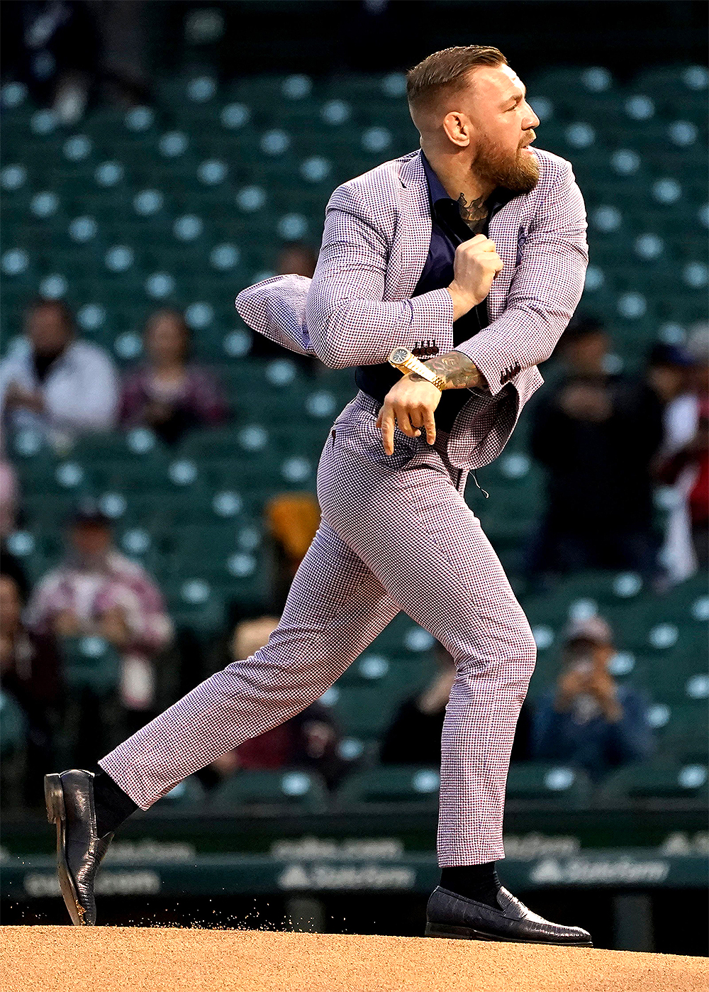 Fighter Conor McGregor throws out a ceremonial first pitch before a baseball game between the Chicago Cubs and the Minnesota Twins, in Chicago
Twins Cubs Baseball, Chicago, United States - 21 Sep 2021