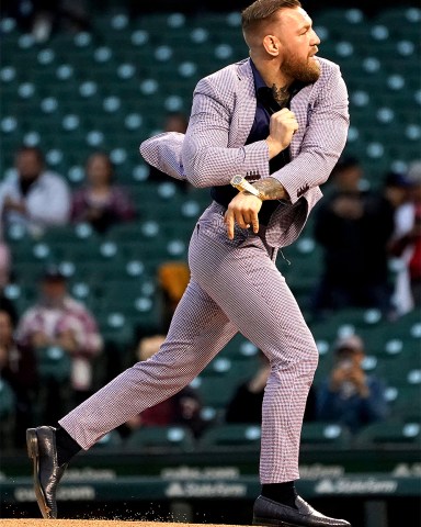 Fighter Conor McGregor throws out a ceremonial first pitch before a baseball game between the Chicago Cubs and the Minnesota Twins, in Chicago
Twins Cubs Baseball, Chicago, United States - 21 Sep 2021