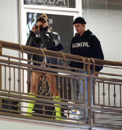 EXCLUSIVE: Justin Bieber wears a black racism wicked hoodie after leaving Sushi Park restaurant with wife Hailey in an oversized leather biker jacket. October 2022 14th Photo: Justin Bieber, Hailey Bieber. Photo credit: MEGA TheMegaAgency.com +1 888 505 6342 (Mega Agency TagID: MEGA907732_014.jpg) [Photo via Mega Agency]