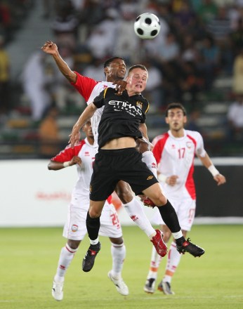 United Arab Emirates Player Amer Mubarak (back) and Manchester City's Kieren Trippier (front) Jump For a Header During the Soccer Friendly Match Between the United Arab Emirates and Manchester City Fc at Zayed Stadium in Abu Dhabi United Arab Emirates On 12 November 2009
Uae Soccer Manchester City - Nov 2009