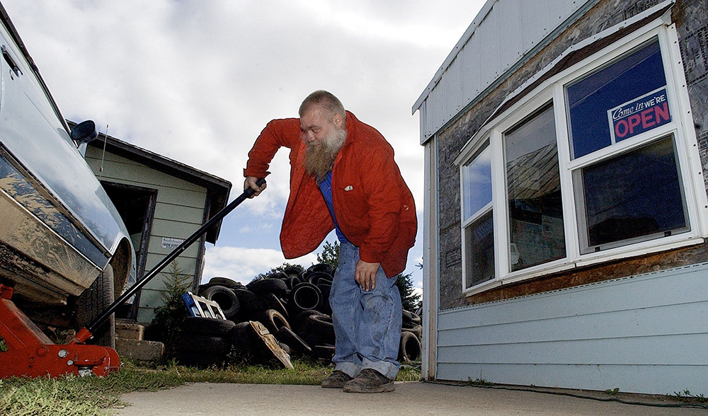 AVERY Steven Avery works on his 1985 Monte Carlo at the family's auto salvage yard, in Two Rivers, Wis. Avery, who spent 18 years in prison for sexual assault, was released two weeks earlier, after DNA tests proved his innocence
FREE MAN AGAIN, TWO RIVERS, USA