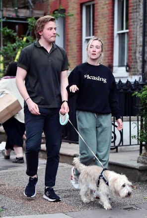 *EXCLUSIVE* London, UNITED KINGDOM  - The American-born Irish actress Saoirse Ronan famed for her roles in "Lady Bird", "The Grand Budapest Hotel" and nominated for best actress in a leading role at the 2020 Oscars for her role in "Little Women" was seen out with her beau, the Scottish actor Jack Lowden.As both Saoirse and Jack donned a casual look whilst out walking with their new puppy, the pair looked loved up during their jaunt out in London.It's a rather dressed down look for Saoirse as as reports claim that the acclaimed actress is joining pal Margot Robbie in Greta Gerwig's glamorous upcoming new movie "Barbie".*PHOTOS SHOT ON 06/09/2022*Pictured: Saoirse Ronan, Jack LowdenBACKGRID USA 12 JUNE 2022 BYLINE MUST READ: NASH / BACKGRIDUSA: +1 310 798 9111 / usasales@backgrid.comUK: +44 208 344 2007 / uksales@backgrid.com*UK Clients - Pictures Containing ChildrenPlease Pixelate Face Prior To Publication*