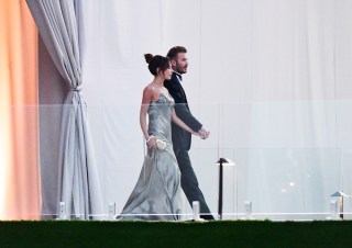 David Beckham and his wife Victoria Beckham enter the dinner tent after their son Brooklyn Beckham married Nicola Peltz in Palm Beach, Florida. 09 Apr 2022 Pictured: David Beckham; Victoria Beckham. Photo credit: Backgrid/MEGA TheMegaAgency.com +1 888 505 6342 (Mega Agency TagID: MEGA846274_005.jpg) [Photo via Mega Agency]