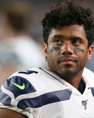 Seattle Seahawks quarterback Russell Wilson watches from the bench during the second half of an NFL preseason football game against the Minnesota Vikings, in Minneapolis
Seahawks Vikings Football, Minneapolis, USA - 18 Aug 2019