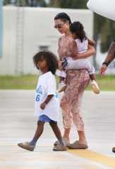 Kim Kardashian and Kanye West touch down in Miami after their 'make or break' vacation in the Dominican Republic. Their private jet left Punta Cana’s private airfield early Sunday morning. There have been no reports as yeton the state of their marriage although rapper Kanye did post a happy family video at the end of last week. In the short clip, West, 43, clad in a hockey jersey, sings what seems to be a snippet from Rebecca Black’s “Friday,” before hopping out of the golf cart he was riding in and dancing alongside it. Kardashian, who seems to be filming, can be heard laughing in the background. There have been no other sightings of the couple who went to extreme lengths not to be seen during the seven-day trip. They stayed in the luxurious Villa Tartaruga at the exclusive Puntacana Resort & Club. Sources say the rapper "suggested they take a family trip together" amid their marital crisis, which saw Kanye, 43, claim he'd been trying to divorce Kim, 39, for two years back in July. Kim and Kanye's marital problems became public knowledge after the rapper shared private details of their life during his presidential rally in July, including the claim that they considered aborting North. Their make or break vacation comes amid claims North would prefer to live with her dad rather than mom Kim. The couple also shares four-year-old son Saint, two-year-old daughter Chicago and one-year-old son Psalm. After Kanye’s meltdown, where he received visitors ranging from Justin Bieber to Dave Chappelle, West visited a Wyoming hospital after he and Kardashian were seen locked in an intense discussion in a parked car. 09 Aug 2020 Pictured: Kim and Kanye. Photo credit: MEGA TheMegaAgency.com +1 888 505 6342 (Mega Agency TagID: MEGA693381_003.jpg) [Photo via Mega Agency]