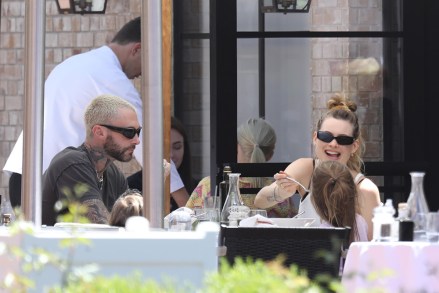 Pacific Palisades, CA - *EXCLUSIVE* Adam Levine takes his model wife Behati Prinsloo and their children to lunch at Angelini Ristorante in Pacific Palisades. PHOTOS: Adam Levine, Behati Prinsloo BACKGRID USA 21 June 2022 USA: +1 310 798 9111 / usasales@backgrid.com UK: +44 208 344 2007 / uksales@backgrid.com Publications*