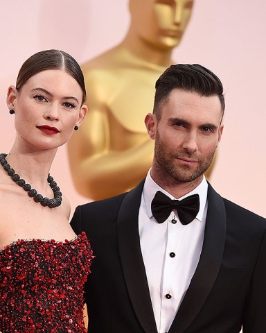 Adam Levine, right, and Behati Prinsloo arrive at the Oscars, at the Dolby Theatre in Los Angeles
87th Academy Awards - Arrivals, Los Angeles, USA - 22 Feb 2015