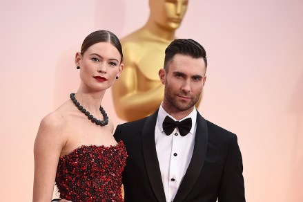 Adam Levine, right, and Behati Prinsloo arrive at the Oscars, at the Dolby Theater in Los Angeles 87th Academy Awards - Arrivals, Los Angeles, USA - 22 Feb 2015