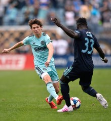 Philadelphia Union's Brenden Aaronson, left, plays the ball against Montreal Impact's Bacary Sagna during the first half of an MLS soccer match, in Chester, Pa
MLS Impact Union Soccer, Chester, USA - 20 Apr 2019