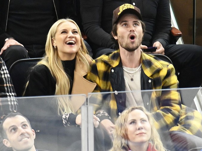 Kelsea Ballerini and Chase Stokes attend a New York Rangers Game