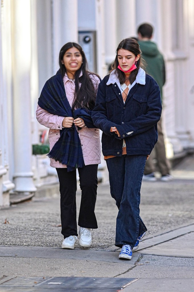 Suri Cruise on a walk with a friend in NYC